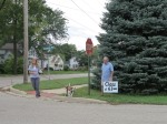 Jim Benkovich places sign