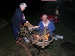 Bette Riedeman and Dick Steward build a bondfire
